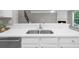 Kitchen sink with stainless steel faucet and sink basin, as well as white cabinets at 220 Finchley Dr, Roswell, GA 30076