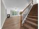 Cozy living room with fireplace, natural light, and staircase at 220 Finchley Dr, Roswell, GA 30076