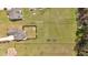 Aerial view of the property featuring a large backyard with dedicated garden plots at 2767 Camp Mitchell Rd, Loganville, GA 30052