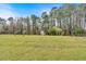 Spacious backyard showcasing a storage shed and lush grass area at 2767 Camp Mitchell Rd, Loganville, GA 30052