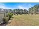 Large backyard featuring a dining set, lots of lush grass, and perimeter trees at 2767 Camp Mitchell Rd, Loganville, GA 30052