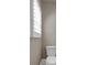 Cozy bathroom with white toilet, and white walls at 2767 Camp Mitchell Rd, Loganville, GA 30052
