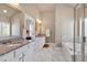 Elegant bathroom featuring double vanity with granite countertop, soaking tub and glass shower at 2767 Camp Mitchell Rd, Loganville, GA 30052