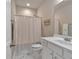 Bathroom featuring a combination shower and tub with a white vanity sink at 2767 Camp Mitchell Rd, Loganville, GA 30052