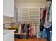 Walk-in closet with built-in shelving and hanging racks at 2767 Camp Mitchell Rd, Loganville, GA 30052