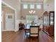 Formal dining room with high ceilings, hardwood floors, natural light, and elegant chandelier at 2767 Camp Mitchell Rd, Loganville, GA 30052