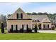 Charming single-Gathering home featuring manicured lawn, inviting curb appeal, and symmetrical window placement at 2767 Camp Mitchell Rd, Loganville, GA 30052