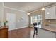 Eat-in kitchen with granite countertops, white cabinetry, and a view of the backyard at 2767 Camp Mitchell Rd, Loganville, GA 30052