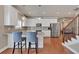 Stylish kitchen featuring white cabinetry, stainless steel appliances, and breakfast bar with seating at 2767 Camp Mitchell Rd, Loganville, GA 30052