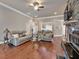 Comfortable living room boasts a fireplace with stone surround and hardwood floors throughout at 2767 Camp Mitchell Rd, Loganville, GA 30052