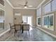 Inviting sunroom with marble flooring, ample seating, and plenty of natural light at 2767 Camp Mitchell Rd, Loganville, GA 30052