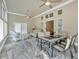 Inviting sunroom with marble flooring, ample seating, and plenty of natural light at 2767 Camp Mitchell Rd, Loganville, GA 30052