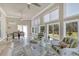 Inviting sunroom with marble flooring, ample seating, and plenty of natural light at 2767 Camp Mitchell Rd, Loganville, GA 30052