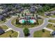 Aerial view of community pool with surrounding homes and landscaping at 5465 Mirror Lake Dr, Cumming, GA 30028
