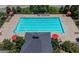 Aerial view of a community pool with seating and umbrellas at 5465 Mirror Lake Dr, Cumming, GA 30028