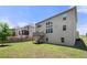 Exterior of home with a large backyard and a wooden deck at 5465 Mirror Lake Dr, Cumming, GA 30028