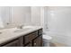 A clean and bright bathroom featuring a shower-tub combination and modern sink at 5465 Mirror Lake Dr, Cumming, GA 30028