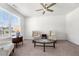 Inviting living room with carpet, neutral tones, and ample natural light at 5465 Mirror Lake Dr, Cumming, GA 30028