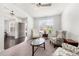 Cozy living room with carpet flooring, a ceiling fan, and natural light at 5465 Mirror Lake Dr, Cumming, GA 30028