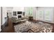 Bright living room features built-in shelving and a fireplace at 5465 Mirror Lake Dr, Cumming, GA 30028