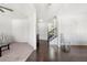 Bright living room featuring hardwood floors, white walls, and staircase at 5465 Mirror Lake Dr, Cumming, GA 30028