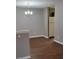 Dining area with dark hardwood floors with plenty of light from the kitchen at 1103 Waldrop Pl, Decatur, GA 30034