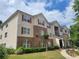 Inviting multi-level apartment building with manicured lawn and colorful window shutters at 1103 Waldrop Pl, Decatur, GA 30034