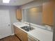 Kitchen featuring stainless steel appliances, wood cabinets, and white countertops at 1103 Waldrop Pl, Decatur, GA 30034