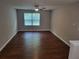 Open living room featuring hardwood floors and ceiling fan with light at 1103 Waldrop Pl, Decatur, GA 30034