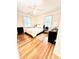 Cozy bedroom showcasing hardwood floors, soft lighting, and ample space for a comfortable retreat at 135 E Hill St # 12, Decatur, GA 30030