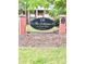Welcoming entrance sign at The Columns at East Hill community with manicured lawn at 135 E Hill St # 12, Decatur, GA 30030