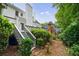 Landscaped backyard with a multi-level deck, perfect for enjoying the outdoors at 1730 Point Pleasant Se, Smyrna, GA 30080