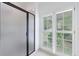 Clean bathroom showcasing glass enclosed shower and large shuttered windows at 1730 Point Pleasant Se, Smyrna, GA 30080