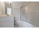 Bathroom with tub and shower combo with glass door at 1730 Point Pleasant Se, Smyrna, GA 30080