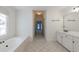 Bright bathroom with white cabinets and jacuzzi tub view at 1730 Point Pleasant Se, Smyrna, GA 30080