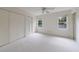 Spacious bedroom featuring plush carpeting, ceiling fan and double closets at 1730 Point Pleasant Se, Smyrna, GA 30080