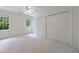 Spacious bedroom with white walls, plush carpeting, and ample closet space at 1730 Point Pleasant Se, Smyrna, GA 30080