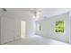 Bright bedroom featuring a ceiling fan and multiple windows for natural light at 1730 Point Pleasant Se, Smyrna, GA 30080