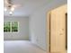 Neutral bedroom with carpeted floors and an open doorway to the hall at 1730 Point Pleasant Se, Smyrna, GA 30080