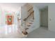 Bright foyer with tiled floor, crystal chandelier, and staircase at 1730 Point Pleasant Se, Smyrna, GA 30080