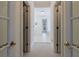 Bright hallway featuring french doors leading to another bedroom and bathroom at 1730 Point Pleasant Se, Smyrna, GA 30080
