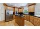 Kitchen boasts stainless steel appliances, granite countertops, and wood cabinets at 1730 Point Pleasant Se, Smyrna, GA 30080
