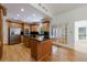 Open kitchen features wood cabinets, granite countertops and stainless steel appliances at 1730 Point Pleasant Se, Smyrna, GA 30080