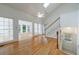 Spacious living room with lots of windows and natural light, a ceiling fan, and a stair case at 1730 Point Pleasant Se, Smyrna, GA 30080