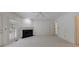Bright living room featuring a black marble fireplace and natural light from the double doors to the outside at 1730 Point Pleasant Se, Smyrna, GA 30080