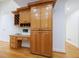 Built in office space with wooden cabinets and drawers to the side in an open space concept at 1730 Point Pleasant Se, Smyrna, GA 30080
