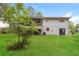 Backyard featuring a house, grass, and privacy fence at 2757 Shelley Ln, Ellenwood, GA 30294
