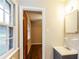 Hall bathroom featuring vanity, sink, mirror, and window at 2757 Shelley Ln, Ellenwood, GA 30294