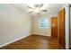 Cozy bedroom with hardwood floors, neutral walls, and a ceiling fan at 2757 Shelley Ln, Ellenwood, GA 30294