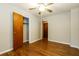 Bedroom with hardwood floors and neutral walls with closet at 2757 Shelley Ln, Ellenwood, GA 30294